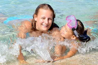 Photo of young mother and child on beach in Lanzaote